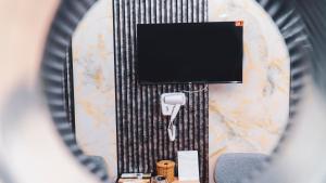 a view of a table with a camera and a television at Thanh Binh Premium Hotel in Ho Chi Minh City +71 photos