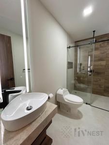a bathroom with a sink and a toilet and a shower at Private Suite with bathroom and top amenities in La Cañada