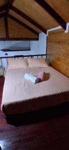 a baby doll is laying on a bed at Departamento Interior independiente in Coquimbo