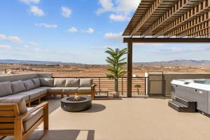 a living room with a couch and a fire pit at Terra Rossa townhouse in St. George