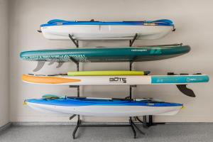 a group of kayaks on a rack in a room at Terra Rossa townhouse in St. George +63 photos