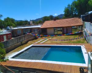 a swimming pool on the roof of a house at Hostel IV Estaciones in San Luis
