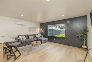 a living room with a couch and a table at The Flats- Executive Suite-Downtown CDA in Coeur d'Alene