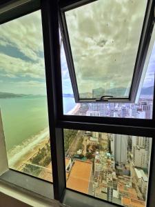 an ocean view from a window of a skyscraper at Little House Sea in Nha Trang