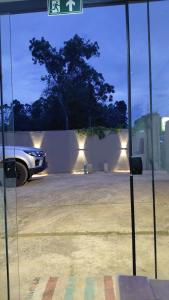 a car parked in a parking lot with lights at Chalé Jaguary com hidro,Monte Verde MG in Companhia +15 photos