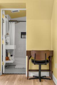 a bathroom with a desk and a shower at Assemble Boise in Boise +66 photos