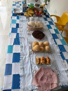 a blue and white table with food on it at Hotel Classic in Porangatu