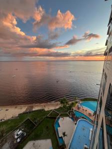 a view of the ocean from a building at Flat Tropical Hotel Com Varanda Vista Espetacular in Manaus