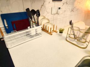 a kitchen counter with a rack of utensils at Arbo Unit in Seoul