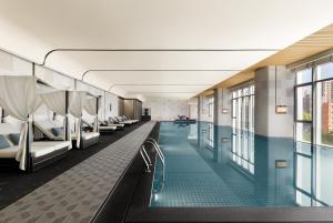 a swimming pool in a hotel room with beds at Xi'an Marriott Hotel High-Tech Zone in Xi'an