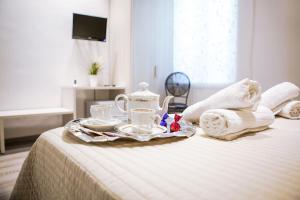 Postel nebo postele na pokoji v ubytování Venere Rooms