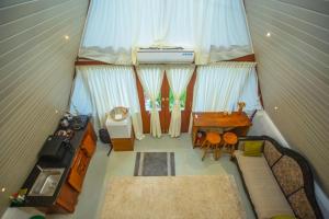 a view of a living room in a tiny house at River Bend Nook in Ahangama
