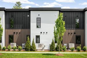 a house with a black and white exterior at Hamilton Place in Traverse City