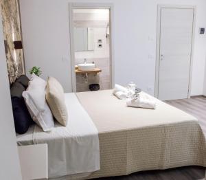 Postel nebo postele na pokoji v ubytování Venere Rooms