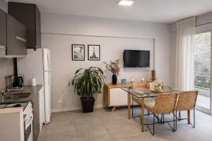a kitchen with a table and a dining room at CONFORT BELGRANO in Buenos Aires