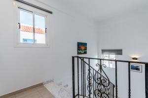a staircase in a house with a window at Seaview Sanctuary House in Larnaca