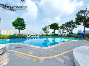 a swimming pool in the middle of a city at TPHomes 12 - The Sun Avenue in Ho Chi Minh City