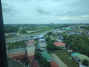 a view of a city with a road and buildings at CeeJay Suites in Penampang