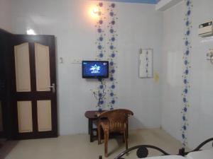 TV a/nebo společenská místnost v ubytování New Regency
