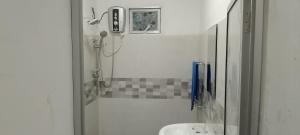 a bathroom with a shower and a sink at Breeze Climes Ella in Ella