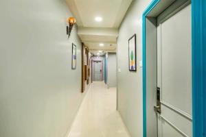 a corridor in a hospital with a hallway at Treebo Aurum Leaf in Nagpur