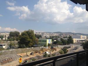 a view of a city from a balcony at The Orange Apartments in Thessaloniki