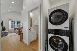a kitchen and living room with a washer and dryer at Private Compound in Decatur in Decatur
