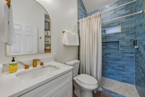 a bathroom with a tub and a toilet and a shower at Private Compound in Decatur in Decatur +56 photos