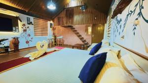 a bedroom with a large bed in a room at Pepper Valley Resort in Kalpetta
