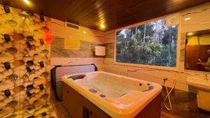 a bathroom with a tub and a sink at Pepper Valley Resort in Kalpetta +86 photos