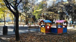 a park with a playground and a swing at Appartamento Ca' Lela in Marghera