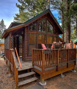 a large wooden cabin with a porch and stairs at Near Ski, Beaches, Pet Friendly, Full kitchen in South Lake Tahoe