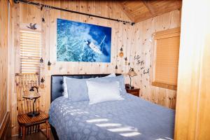 a bedroom with a bed in a wooden wall at Near Ski, Beaches, Pet Friendly, Full kitchen in South Lake Tahoe