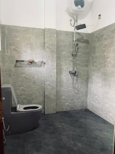 a bathroom with a shower and a toilet at RailNest in Talpe +9 photos