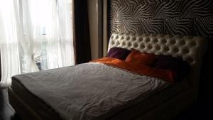 Säng eller sängar i ett rum på Odessa Arcadia