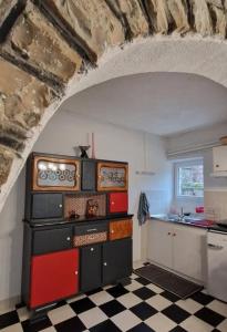 a kitchen with a sink and a counter top at Le gîte d'alfred in Prades +21 photos