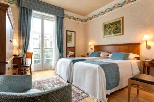 Postel nebo postele na pokoji v ubytování Hotel Firenze + 37 fotografií