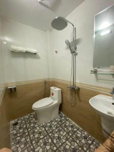 a bathroom with a toilet and a sink at Your Home in Vũ Lâm +33 photos