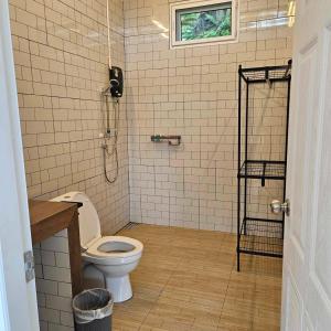a bathroom with a toilet and a shower at khaolakcamping in Ban Lam Ru (1)