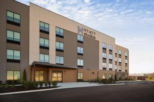 a large building with the words next shark on it at Hyatt Studios Huntsville in Huntsville