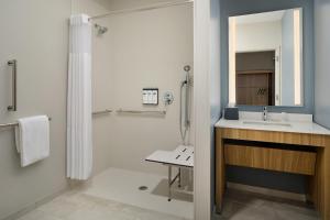 a bathroom with a sink and a shower at Hyatt Studios Huntsville in Huntsville +31 photos