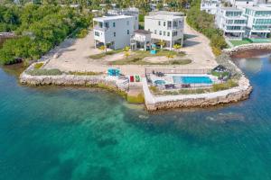 an aerial view of a resort in the water at Chic Ocean Hideaway with Grill in Key Largo