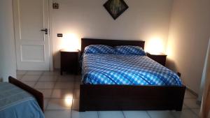 A bed or beds in a room at B&B Sun Garden