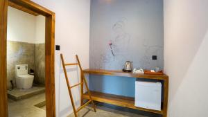 a bathroom with a counter and a toilet at Vilona Nature Villa in Dambulla
