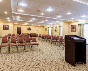a conference room with a row of chairs and a podium at Comfort Suites near NASA - Clear Lake in Webster +29 photos