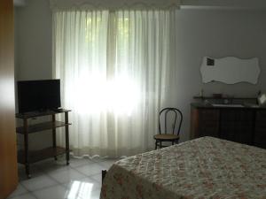 A television and/or entertainment centre at B&B Sun Garden
