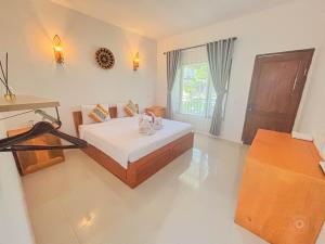 a bedroom with a bed and a window at Trytan Gerupuk Homestay in Bumbang +121 photos