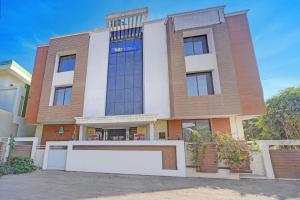 a building with a sign on the front of it at FabHotel Sandalwood Vibes in Bhopal +18 photos