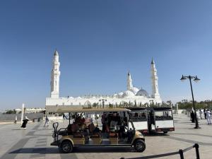 a golf cart in front of a mosque at قمرة قباء Quba moon4 in Medina +5 photos