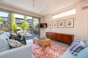 a living room with a couch and a table at Blue Horizons at Ocean Grove in Ocean Grove